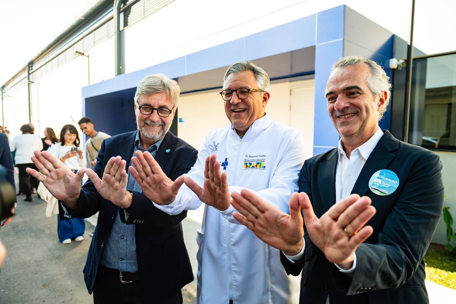 Scott O'Neill, Luciano Moreira and the Brazilian Health Minister pose for a photo.