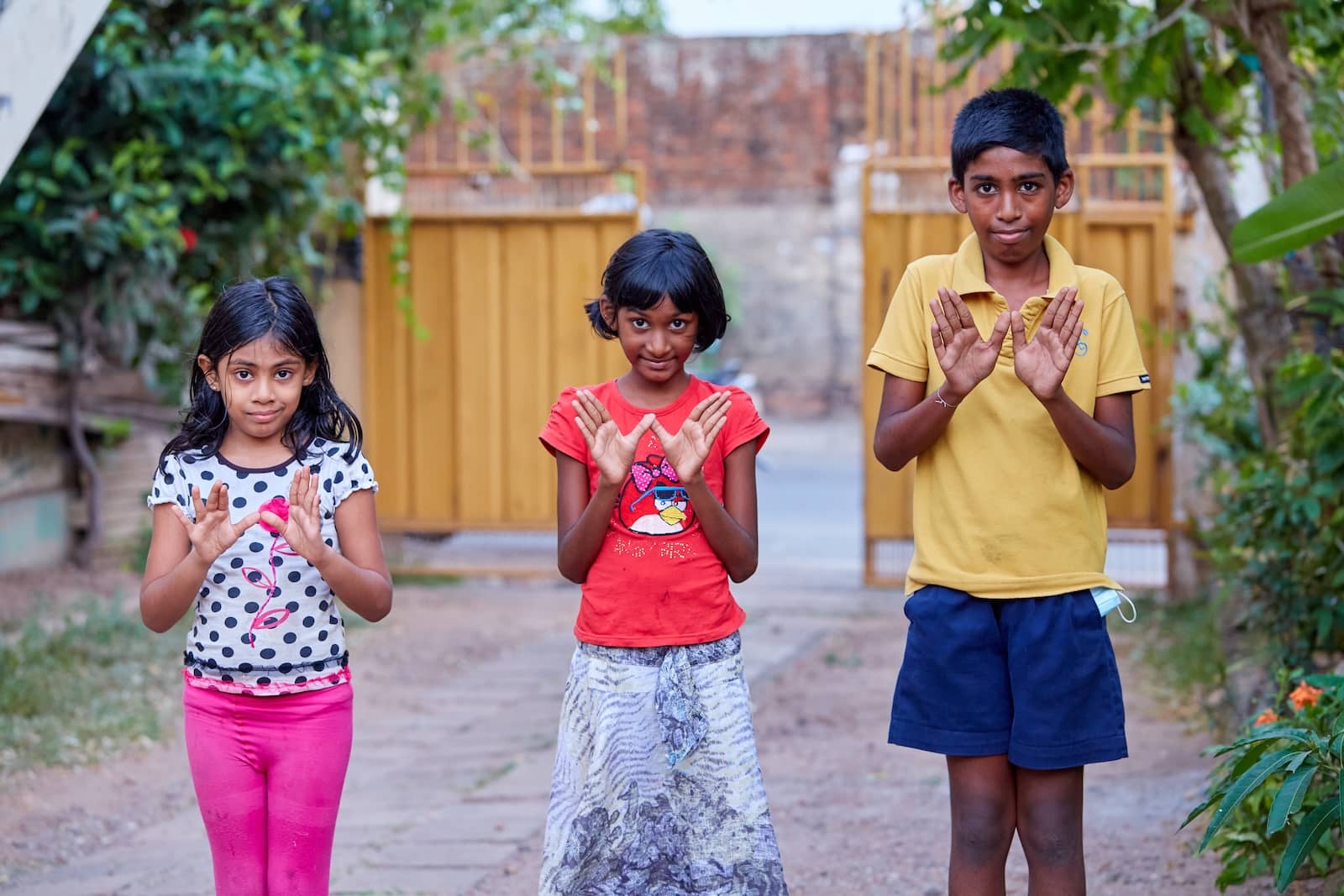 Children doing the W for  world mosquito program